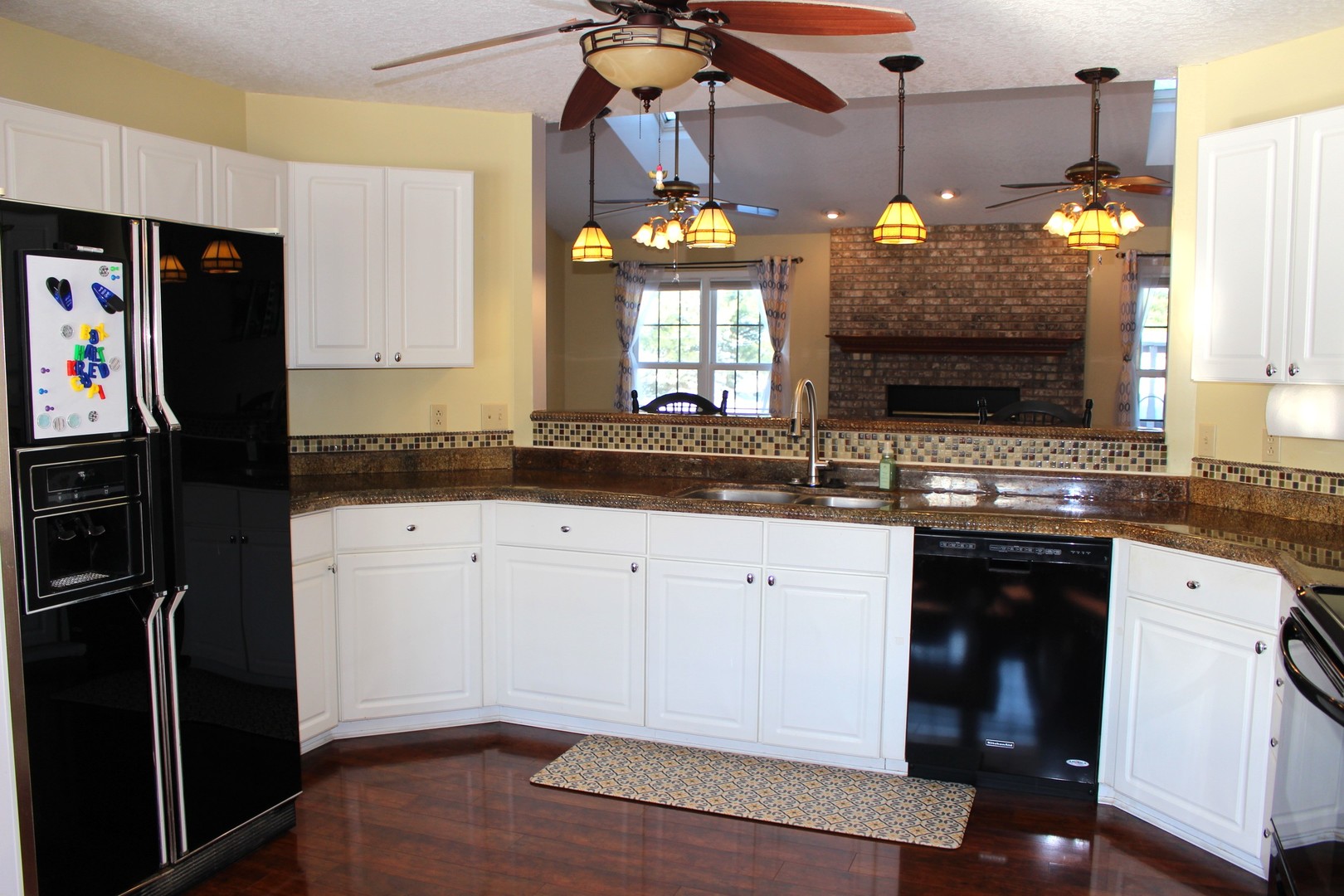 7629 White Oak Road Clinton, IL 61727 - Photo 21 of 47 a kitchen with a sink stainless steel appliances and chandelier