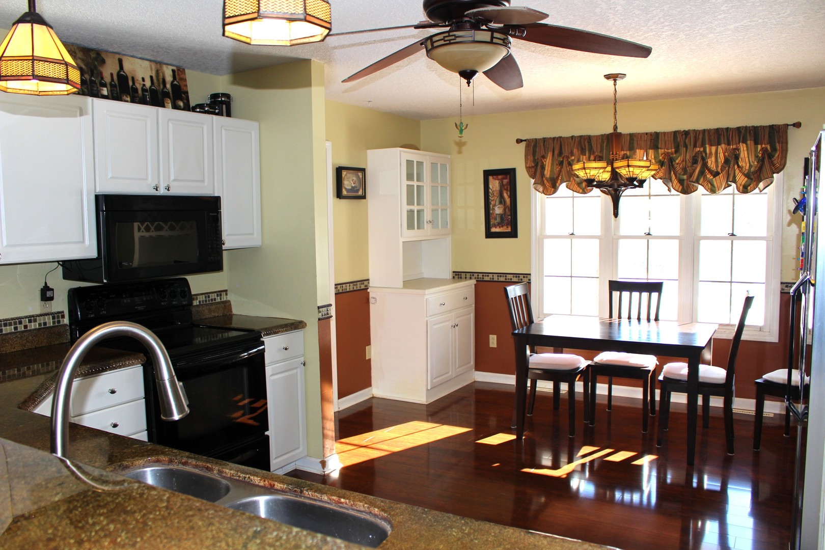 7629 White Oak Road Clinton, IL 61727 - Photo 24 of 47 a view of a dining room with furniture window and wooden floor