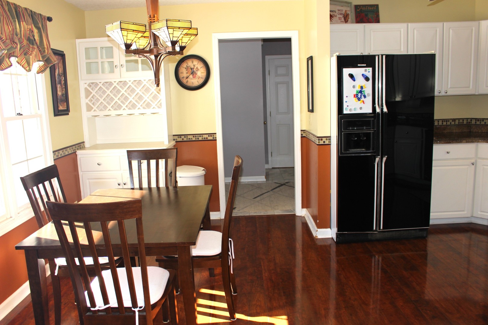 7629 White Oak Road Clinton, IL 61727 - Photo 27 of 47 a view of a dining room with furniture wooden floor and a chandelier