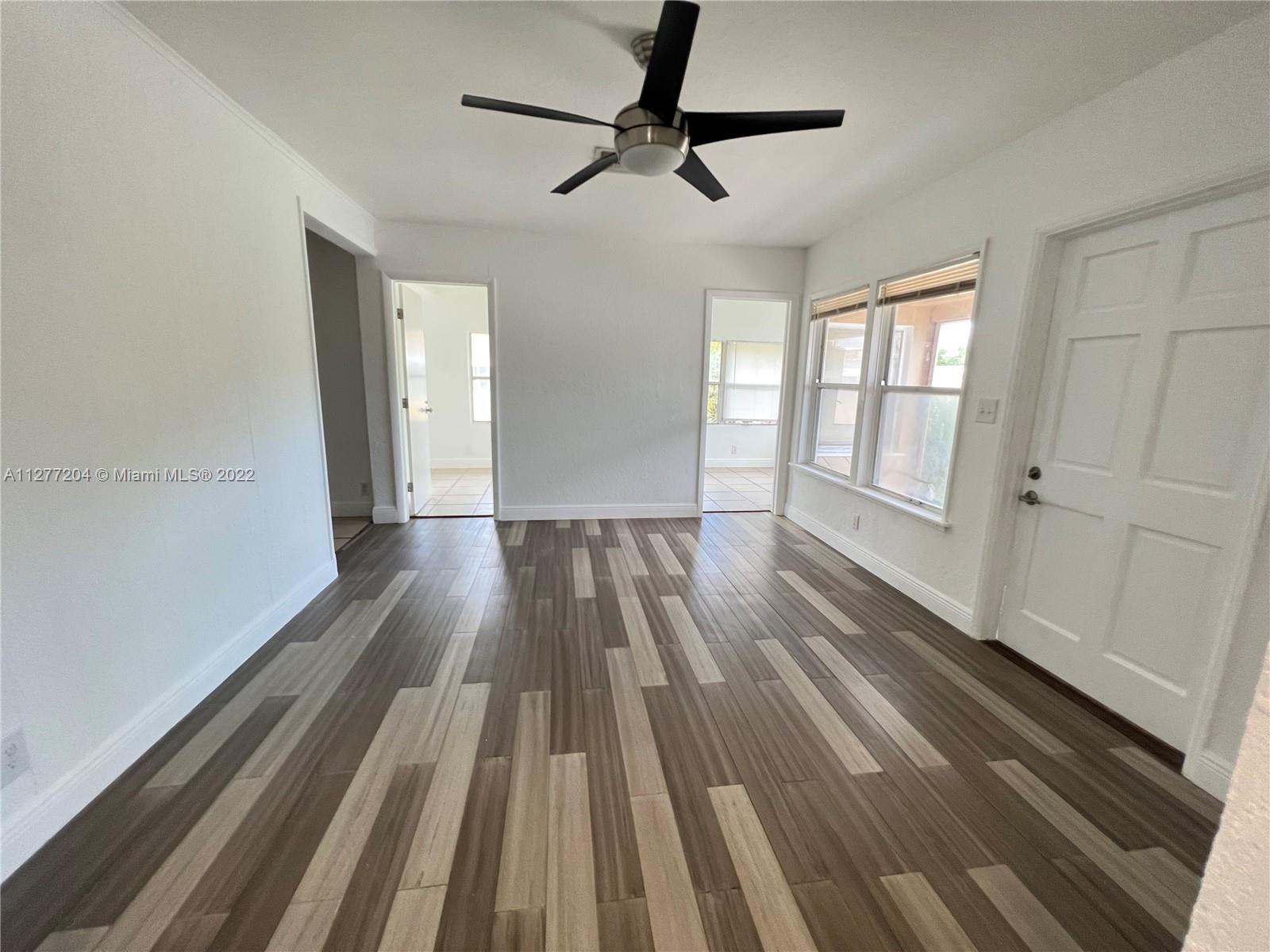 a view of wooden floor in an empty room