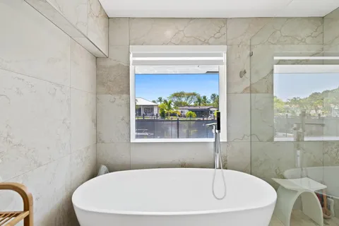 a white bath tub sitting in a bathroom