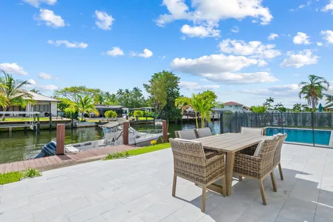 a view of a swimming pool with lounge chairs