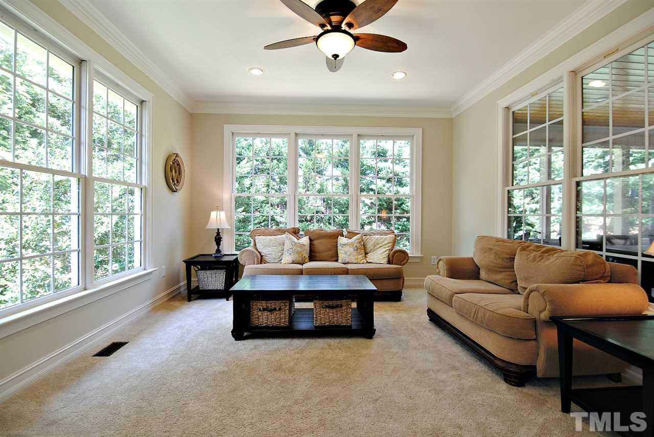 3400 Harden Road Raleigh, NC 27607 - Photo 12 of 25 a living room with furniture and a large window