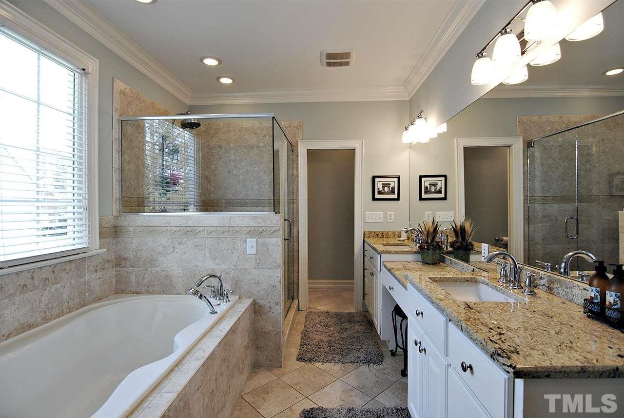 3400 Harden Road Raleigh, NC 27607 - Photo 15 of 25 a bathroom with a granite countertop tub sink and mirror