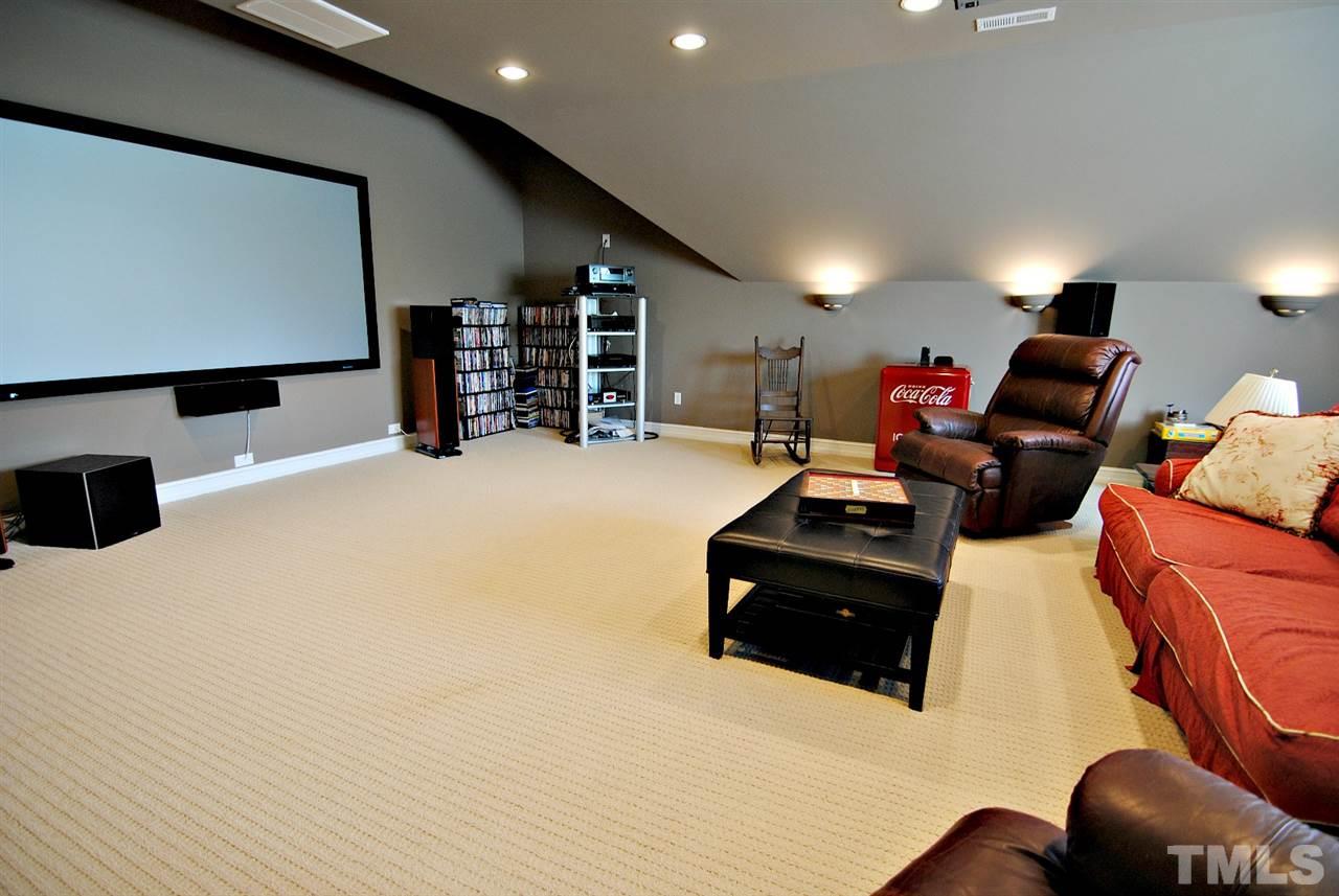 3400 Harden Road Raleigh, NC 27607 - Photo 19 of 25 a living room with furniture and a flat screen tv