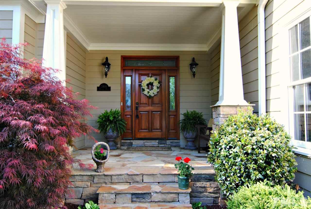 3400 Harden Road Raleigh, NC 27607 - Photo 3 of 25 a vase of flowers sitting in front of a house