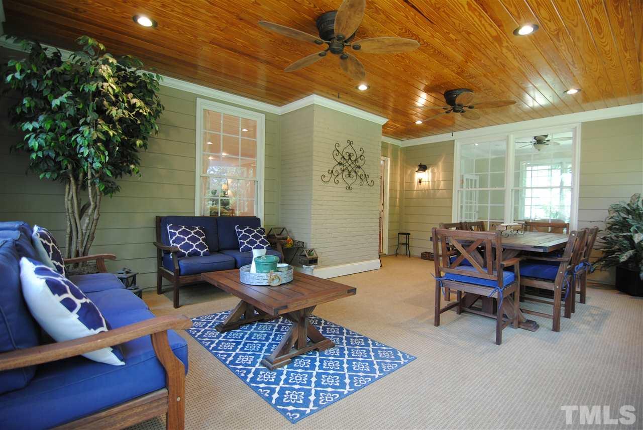 3400 Harden Road Raleigh, NC 27607 - Photo 21 of 25 a living room with furniture and a potted plant