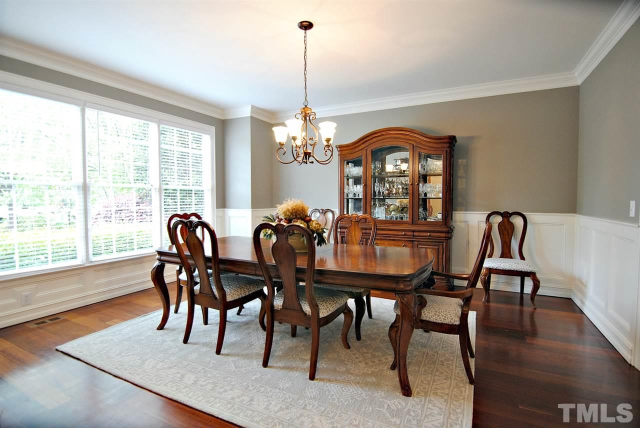 3400 Harden Road Raleigh, NC 27607 - Photo 7 of 25 a view of a dining room with furniture window and wooden floor