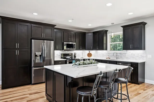 a bedroom with a bed and a view of bedroom