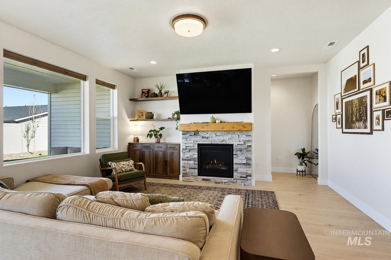 5990 West Ladle Rpds Street Meridian, ID 83646 - Photo 8 of 42 Recessed lighting, wood-finish flooring, and multiple windows