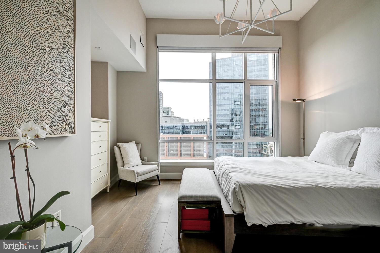 1330 Lancaster Street, Unit C901 Baltimore, MD 21231 - Photo 17 of 55 a bedroom with a bed and a window