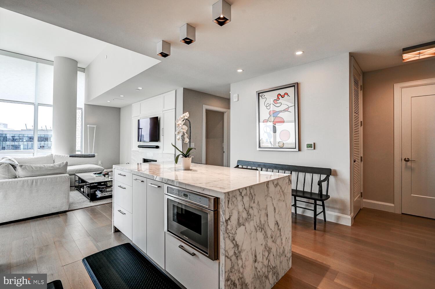 1330 Lancaster Street, Unit C901 Baltimore, MD 21231 - Photo 6 of 55 a kitchen with a stove a sink and a refrigerator