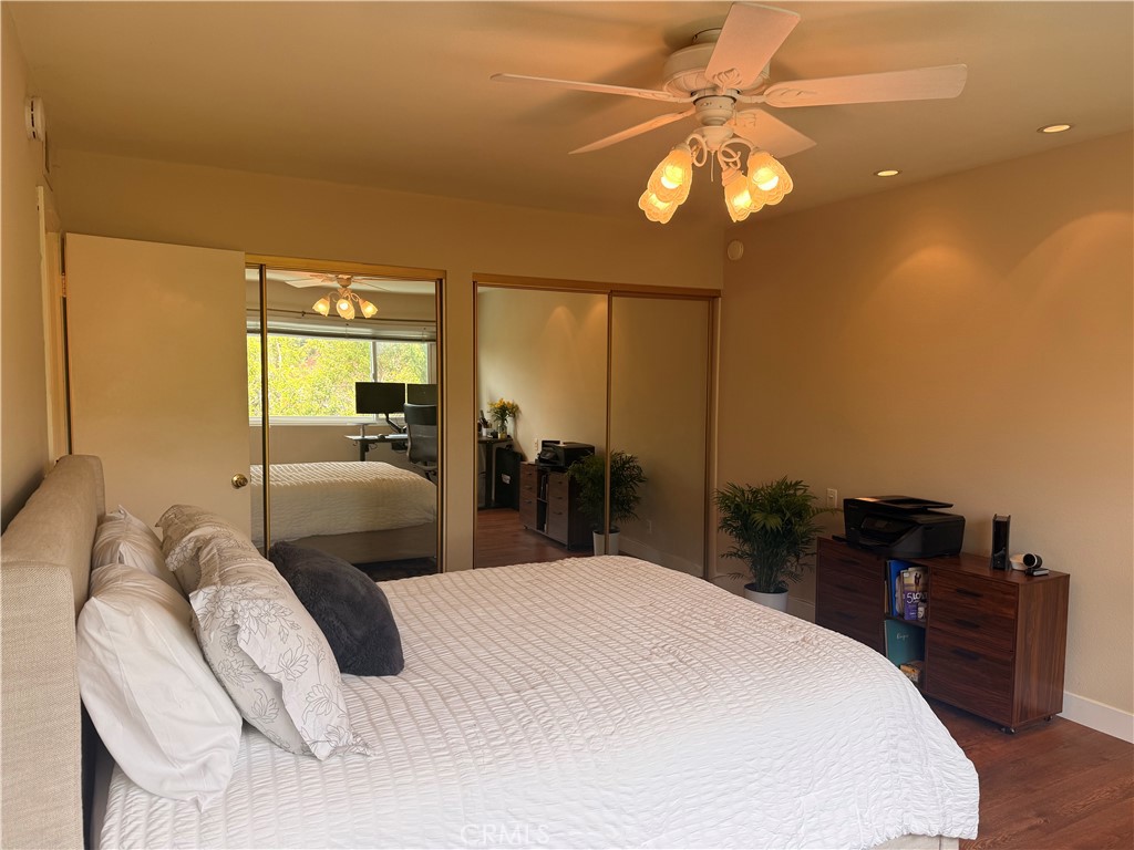 19238 Castlebay Lane Porter Ranch, CA 91326 - Photo 19 of 38 a bedroom with a bed and a chandelier