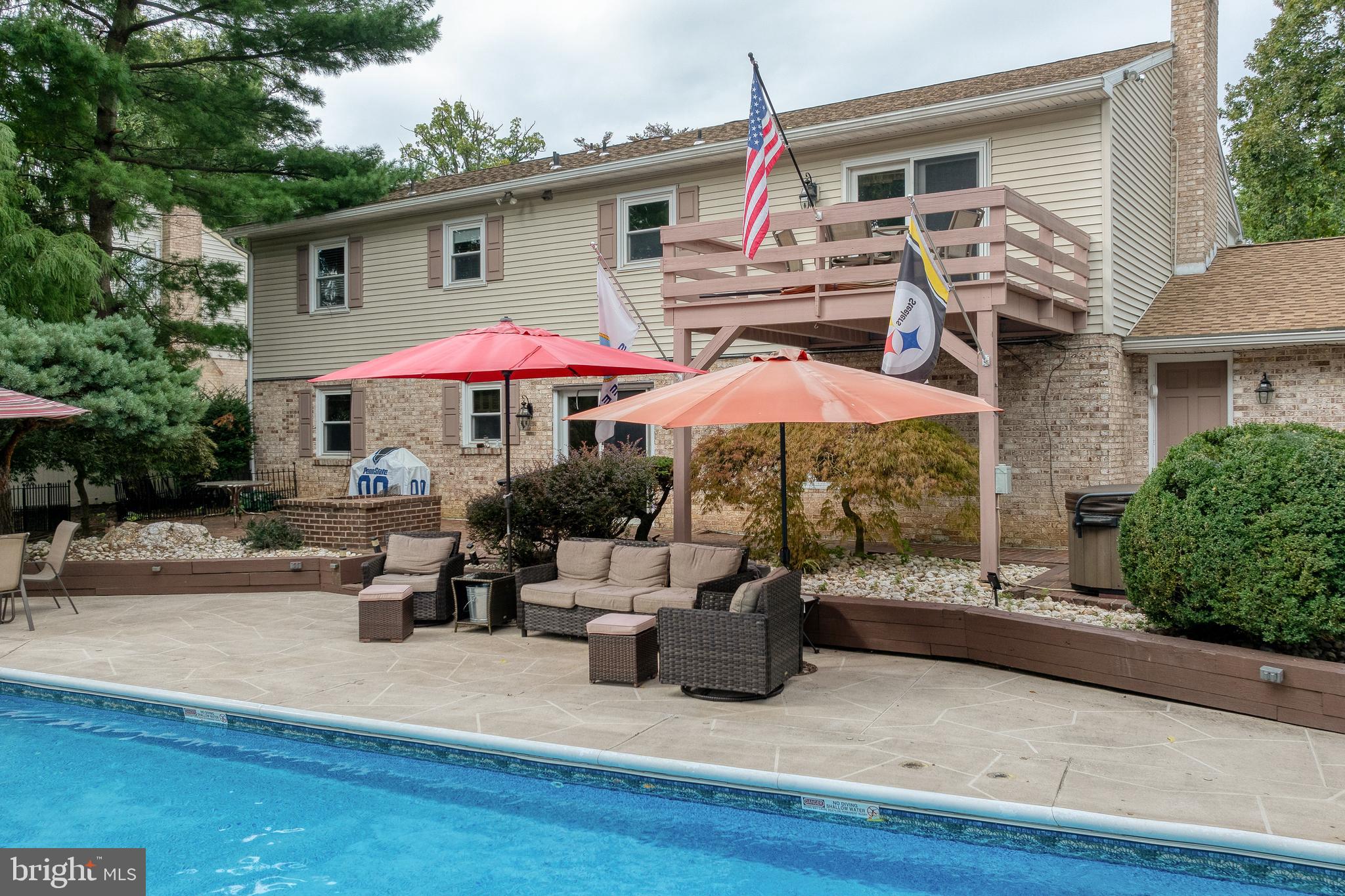 2217 Old Colony Road York, PA 17402 - Photo 54 of 100 a patio with a table and chairs under an umbrella