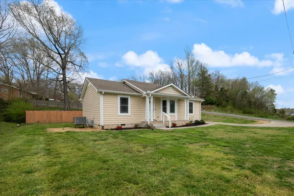a front view of a house with garden