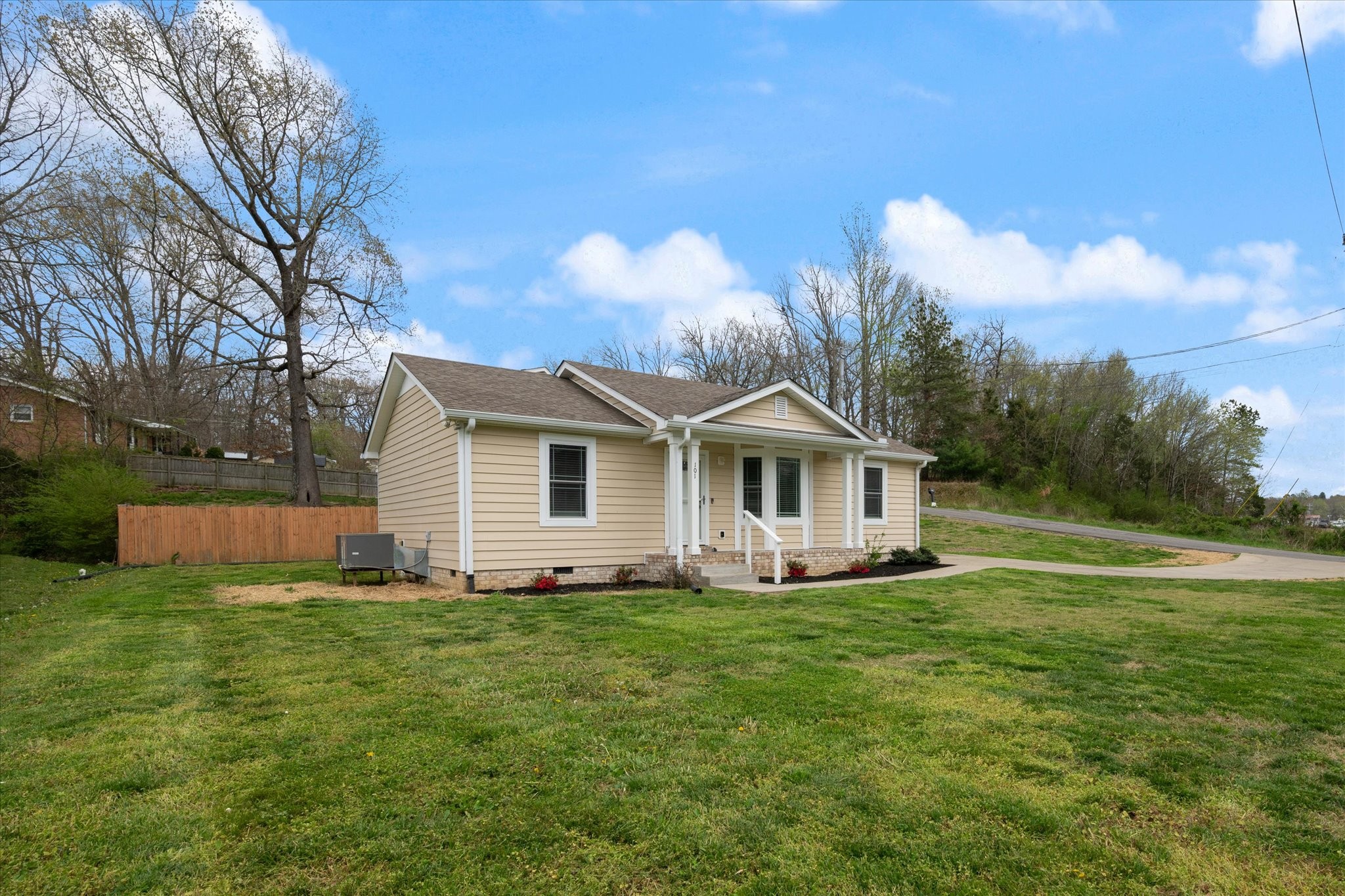 101 Birch Street Dickson, TN 37055 - Photo 1 of 18 a front view of a house with garden
