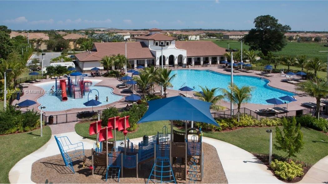 a view of a patio with swimming pool table and chairs