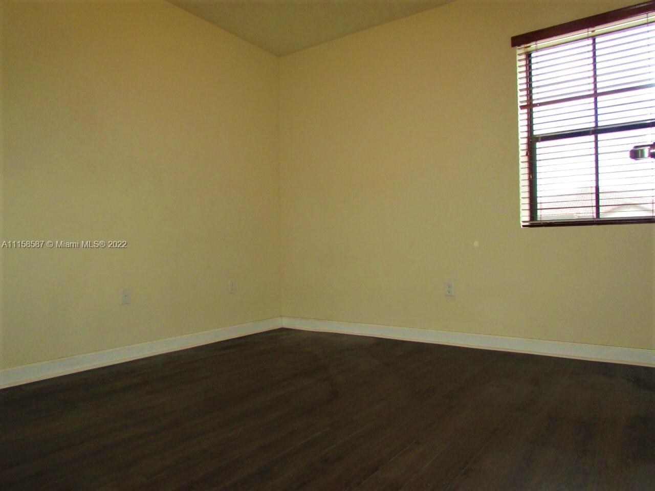 11759 Southwest 235th Street Homestead, FL 33032 - Photo 15 of 21 an empty room with a window