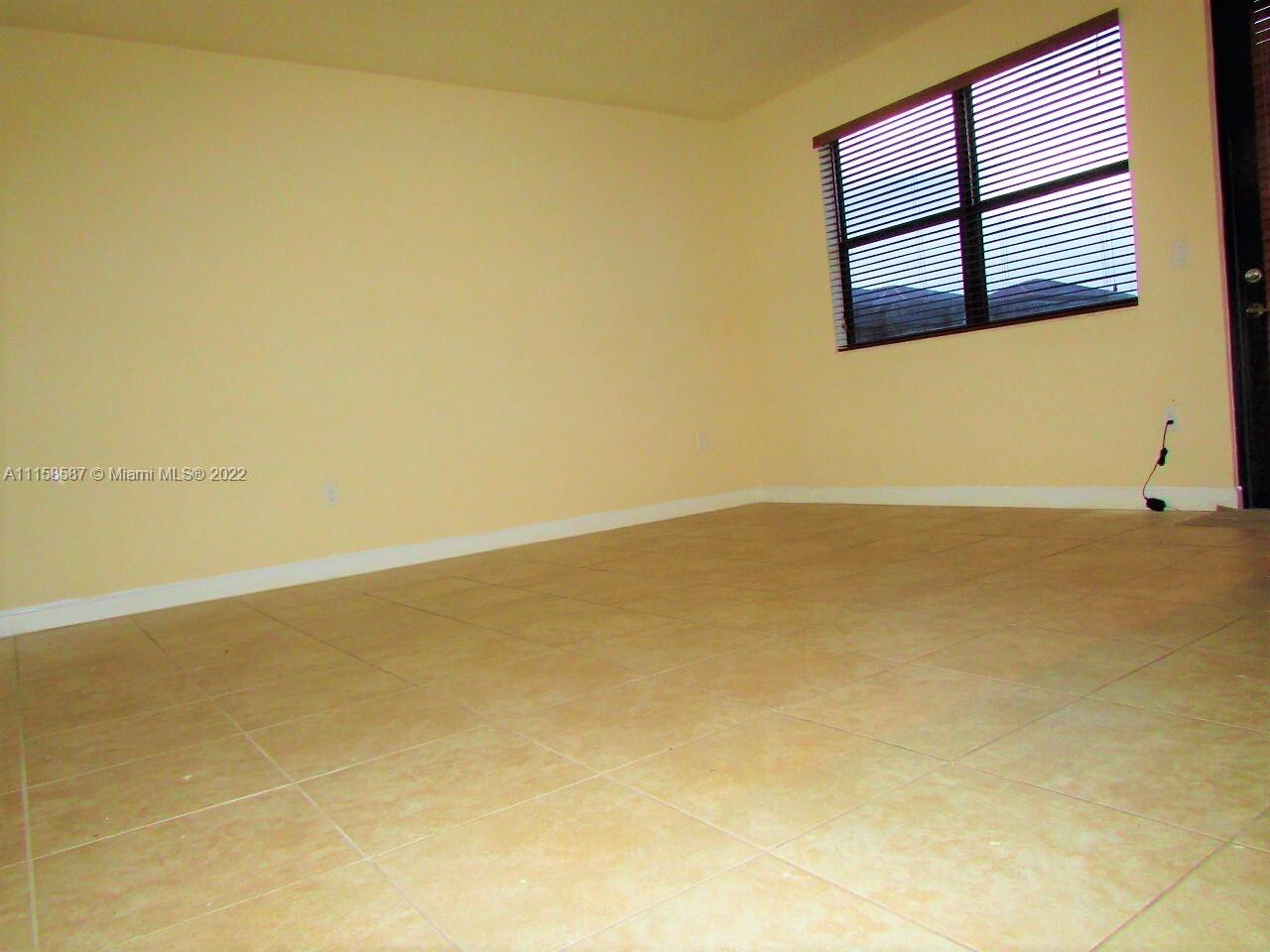 11759 Southwest 235th Street Homestead, FL 33032 - Photo 17 of 21 an empty room with a window