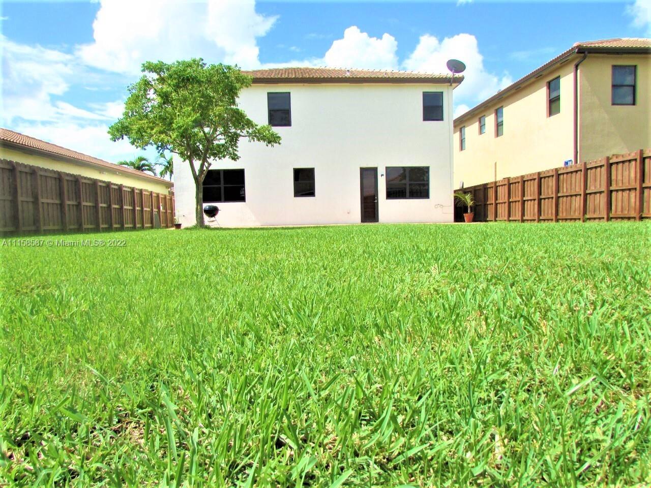 11759 Southwest 235th Street Homestead, FL 33032 - Photo 8 of 21 a view of a back yard of the house