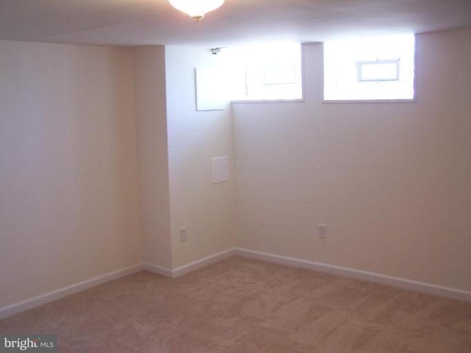 1558 Winford Road Baltimore, MD 21239 - Photo 5 of 9 a view of an empty room