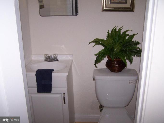 1558 Winford Road Baltimore, MD 21239 - Photo 7 of 9 a bathroom with a sink and mirror