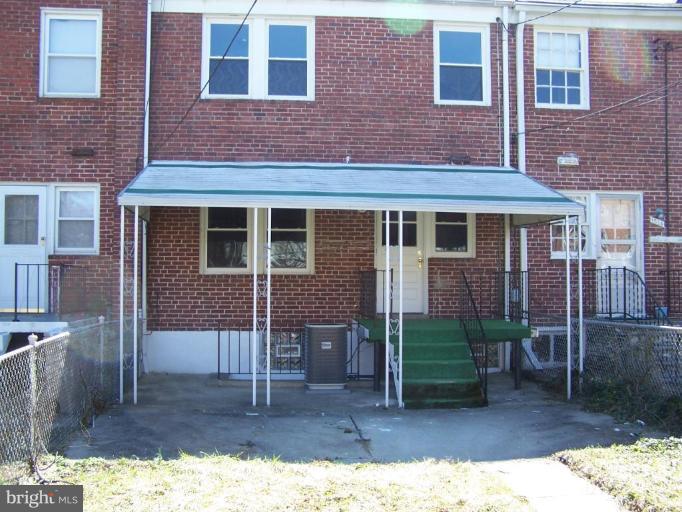 1558 Winford Road Baltimore, MD 21239 - Photo 9 of 9 a view of a house with a yard