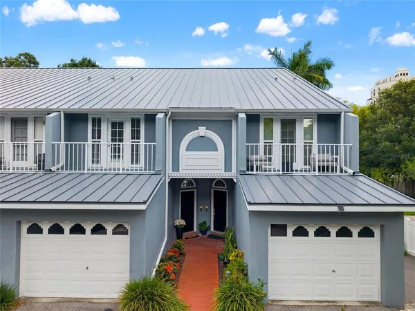 a front view of a house with yard