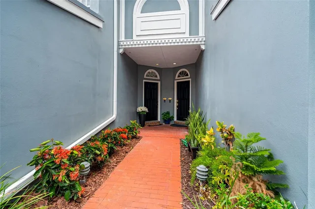 a entryway with flower pots