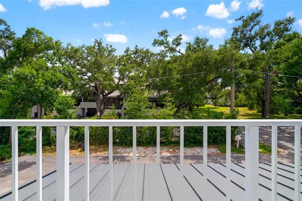 a view of a two chairs with wooden fence