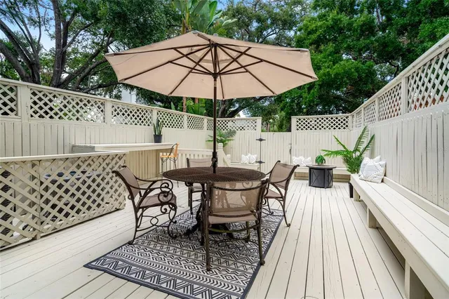 an outdoor space with furniture and umbrella