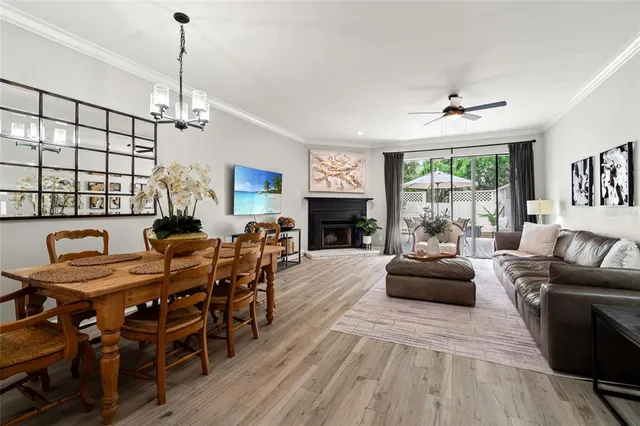 a view of a livingroom with furniture window and wooden floor