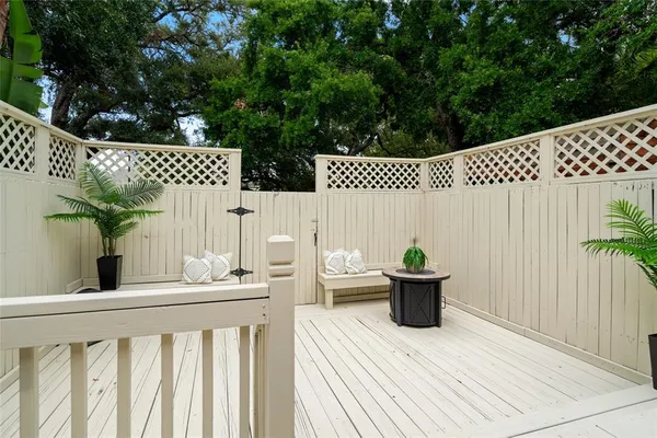 a view of a deck with furniture
