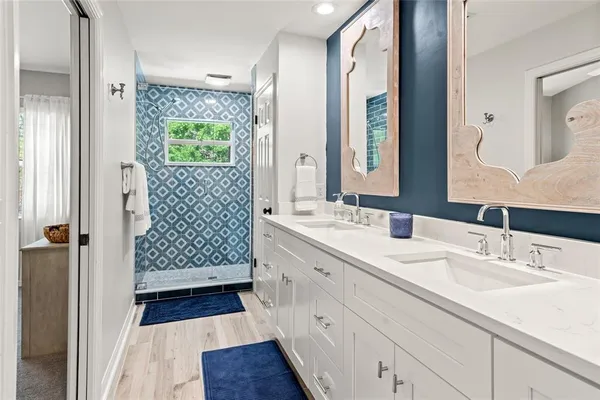 a bathroom with a sink and a mirror