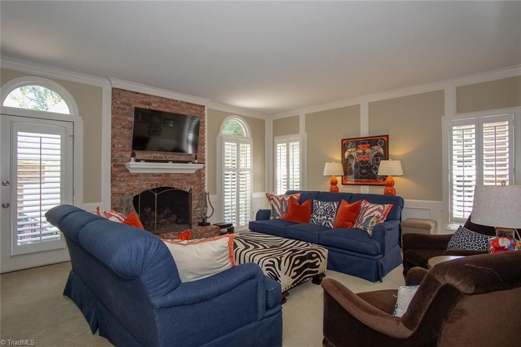 6037 Rittenhouse Road Winston-Salem, NC 27104 - Photo 12 of 30 The den features a working masonry fireplace!