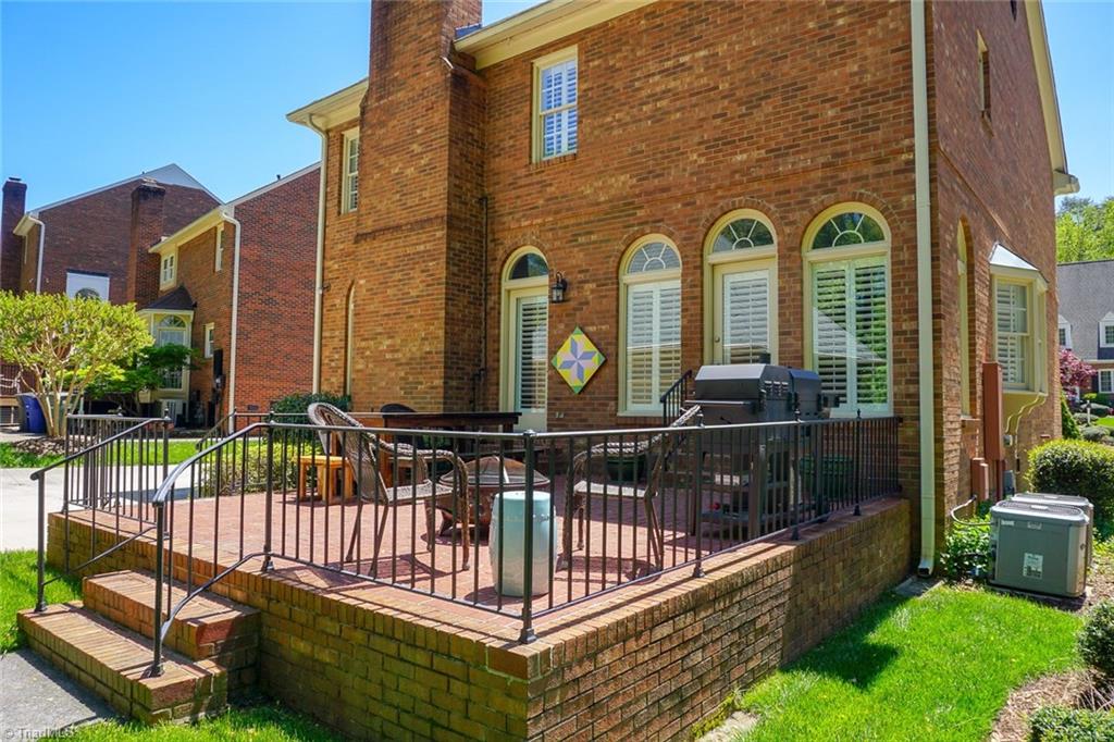 6037 Rittenhouse Road Winston-Salem, NC 27104 - Photo 25 of 30 The rear brick patio provides another space for entertaining!