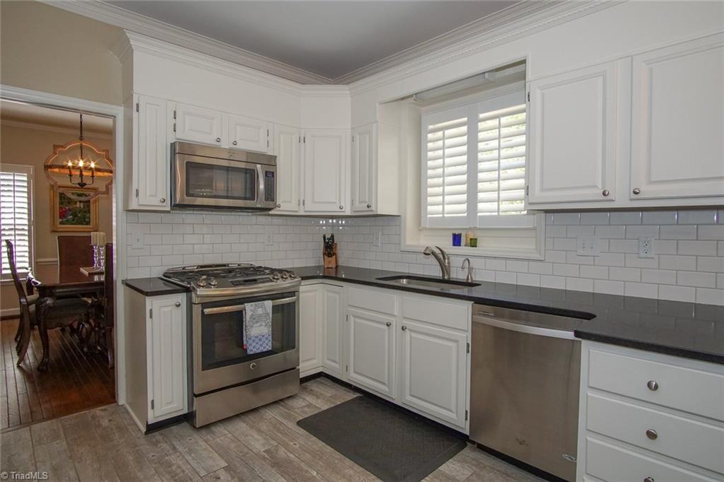 6037 Rittenhouse Road Winston-Salem, NC 27104 - Photo 8 of 30 This gourmet renovated kitchen (with high-end gas range) will delight you!