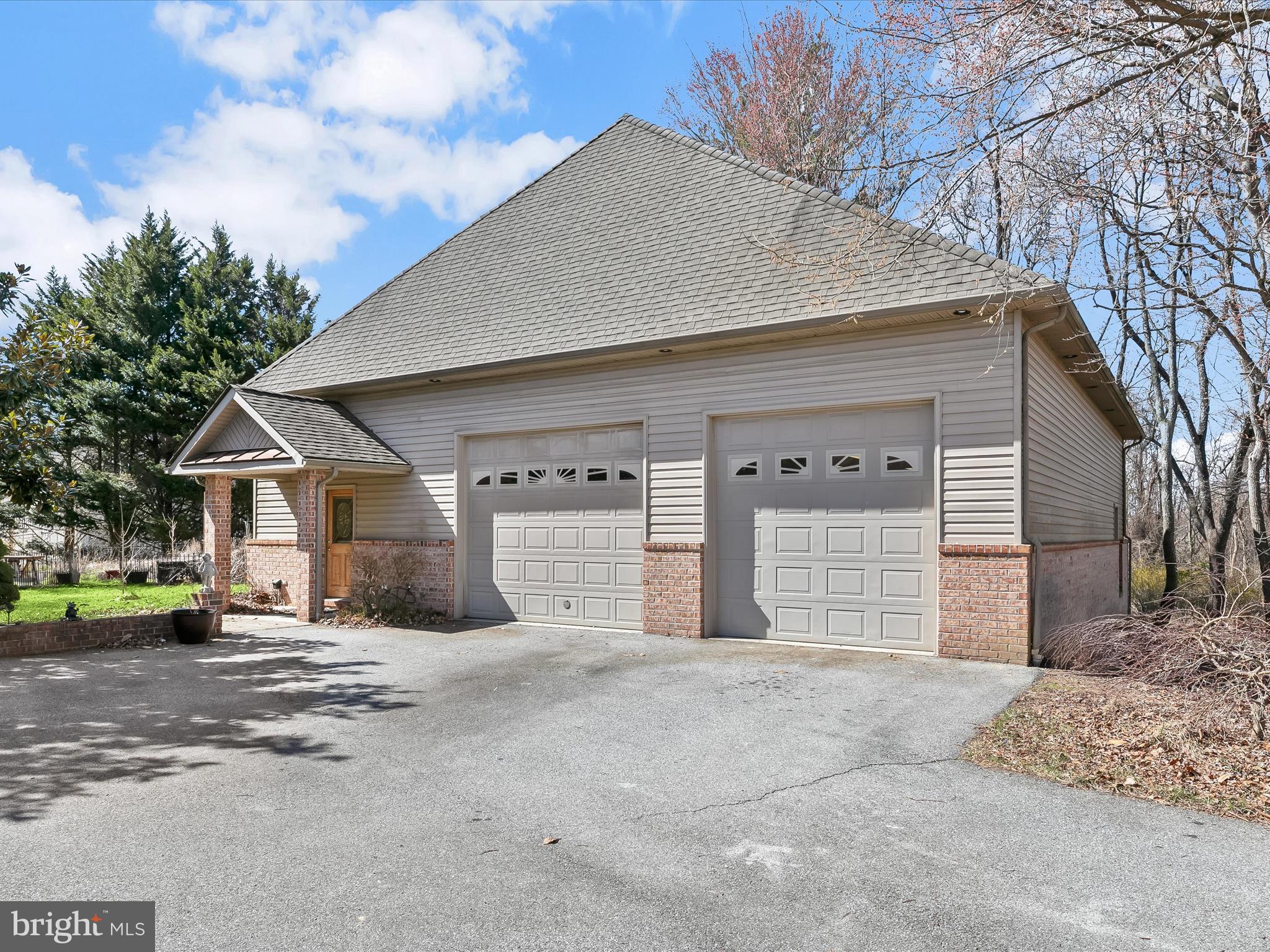 3155 Clarho Circle Finksburg, MD 21048 - Photo 2 of 70 a front view of a house with a yard and garage