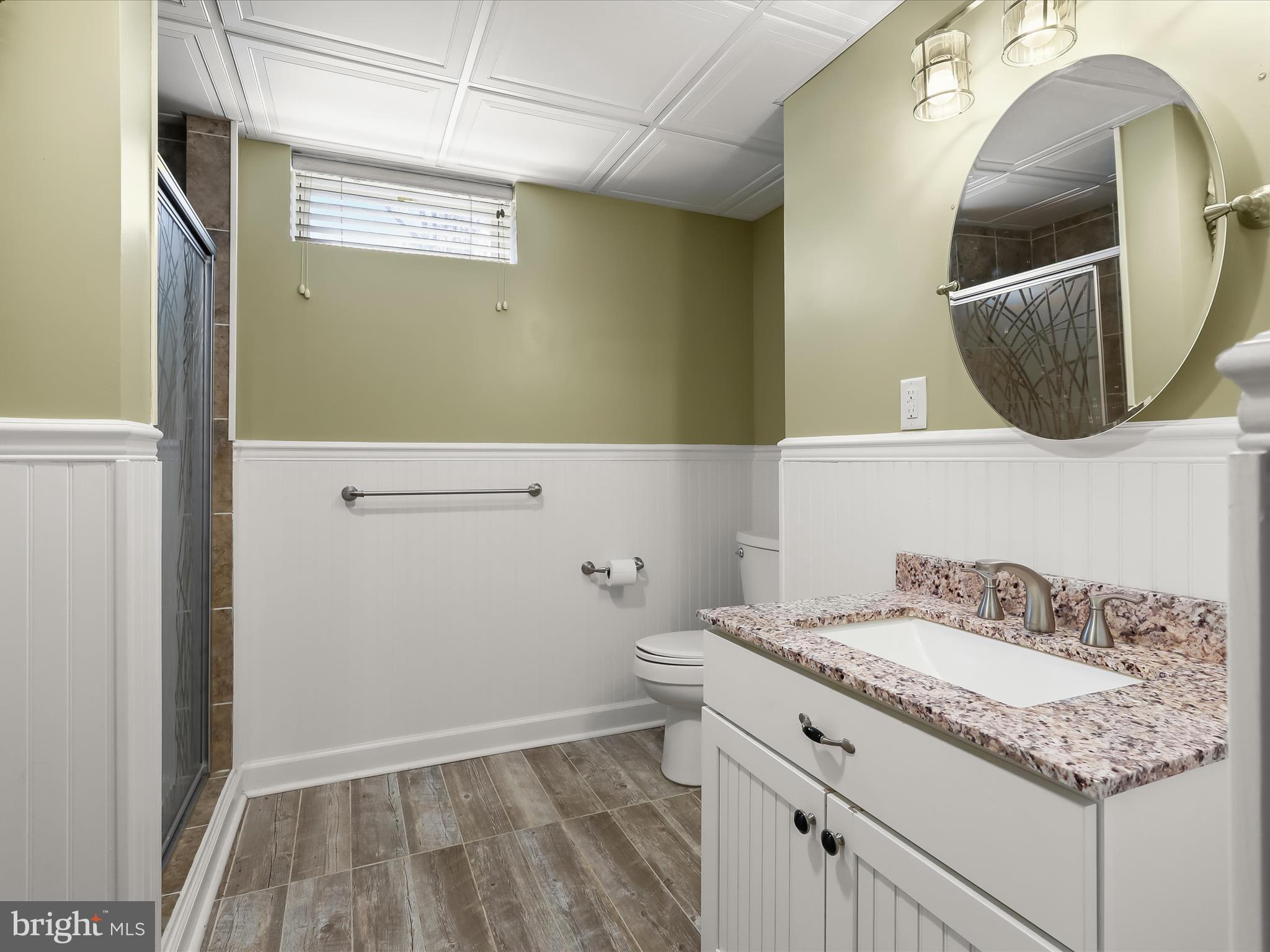 3155 Clarho Circle Finksburg, MD 21048 - Photo 49 of 70 a bathroom with a granite countertop sink and a mirror