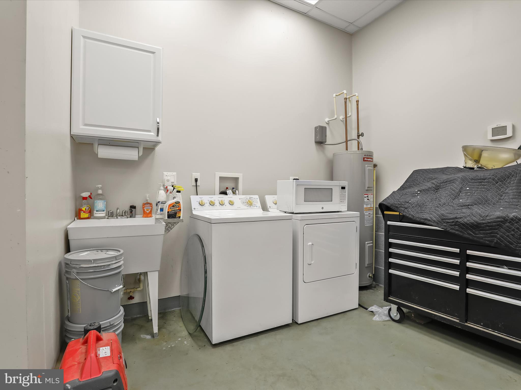 3155 Clarho Circle Finksburg, MD 21048 - Photo 62 of 70 a utility room with cabinets dryer and washer