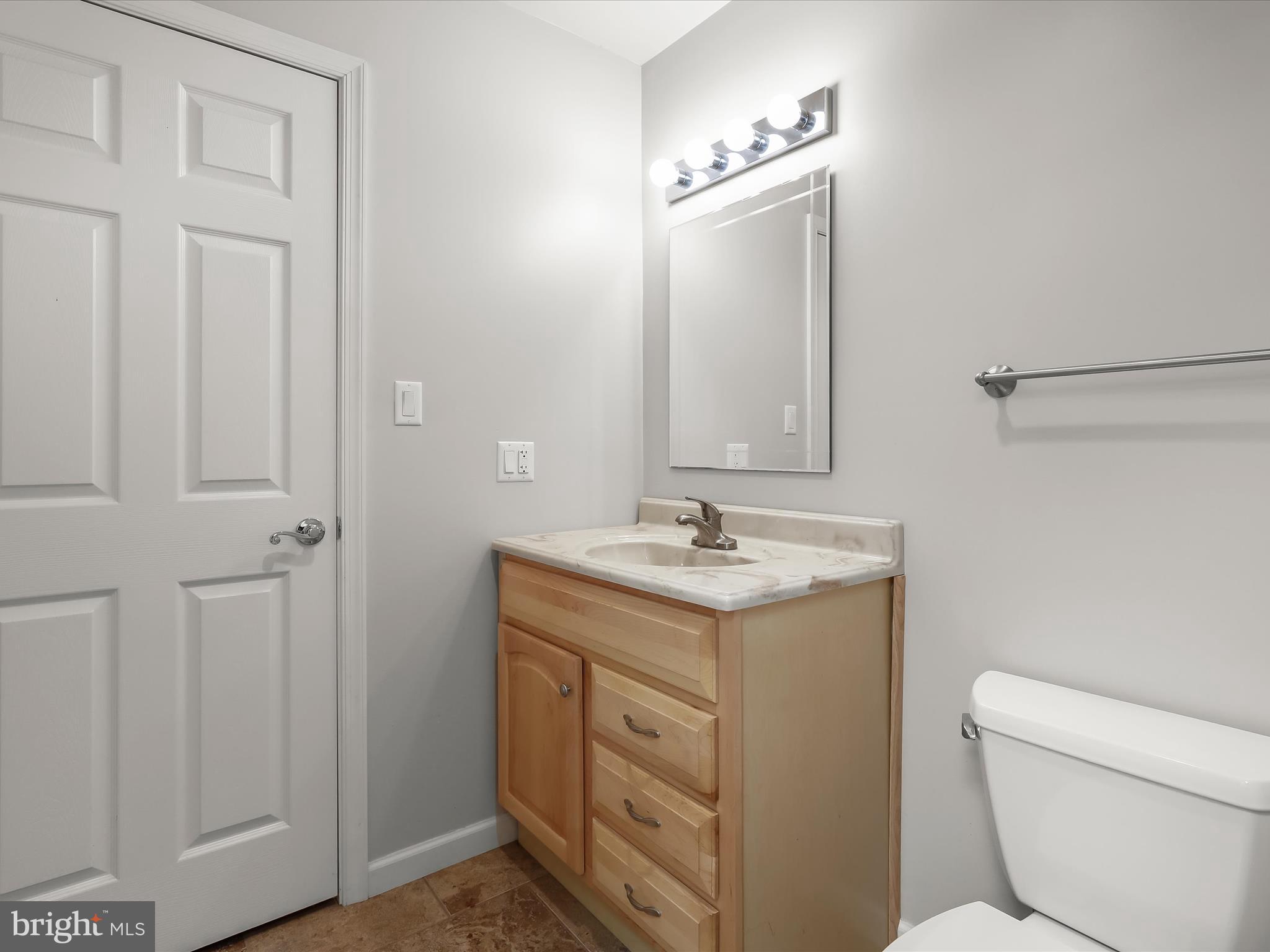 3155 Clarho Circle Finksburg, MD 21048 - Photo 63 of 70 a bathroom with a toilet a sink and mirror