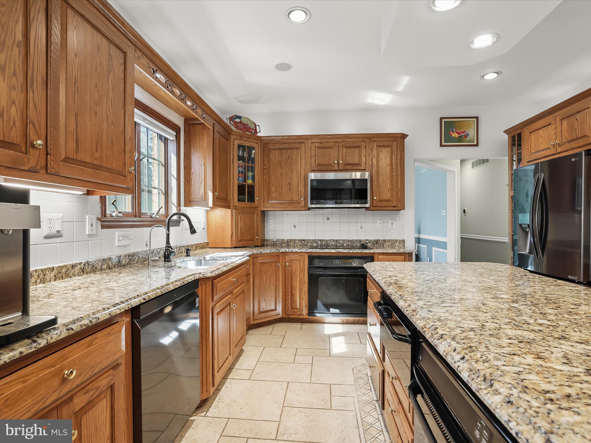 3155 Clarho Circle Finksburg, MD 21048 - Photo 9 of 70 a kitchen with stainless steel appliances granite countertop a sink stove and refrigerator