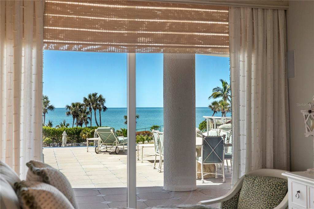 2251 Gulf Of Mexico Drive, Unit 203 Longboat Key, FL 34228 - Photo 18 of 21 a living room with furniture and a potted plant
