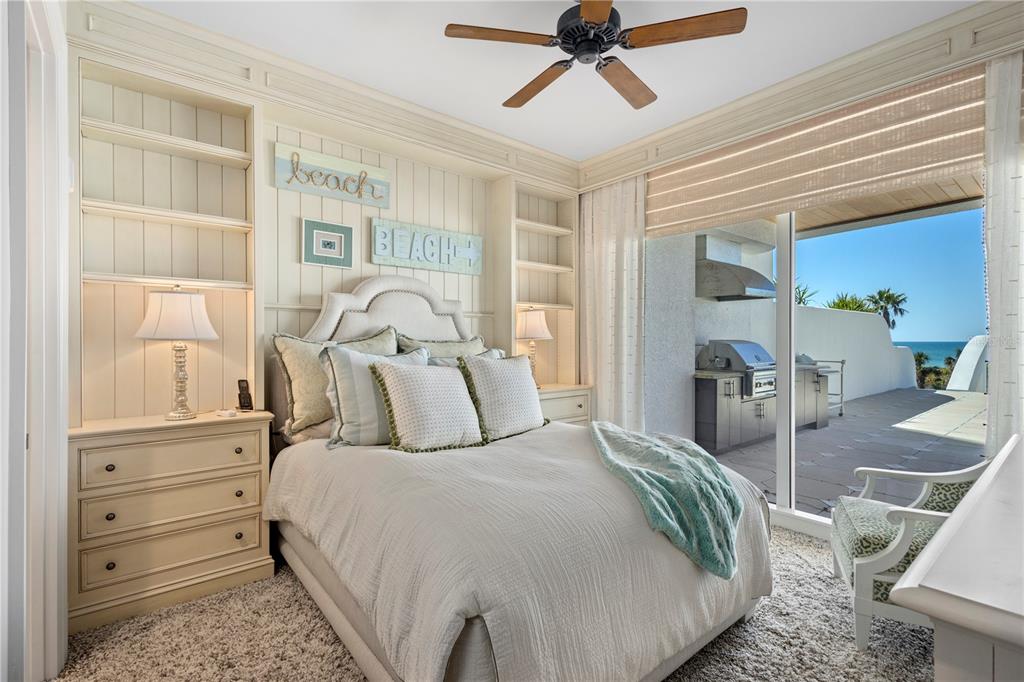 2251 Gulf Of Mexico Drive, Unit 203 Longboat Key, FL 34228 - Photo 9 of 21 a bedroom with a bed and wooden floor