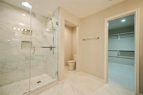 a bathroom with a shower and a mirror