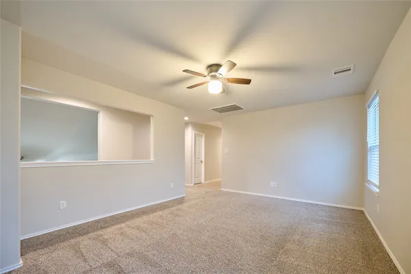 a view of an empty room with a window