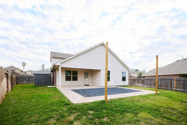 a front view of house with yard and swimming pool