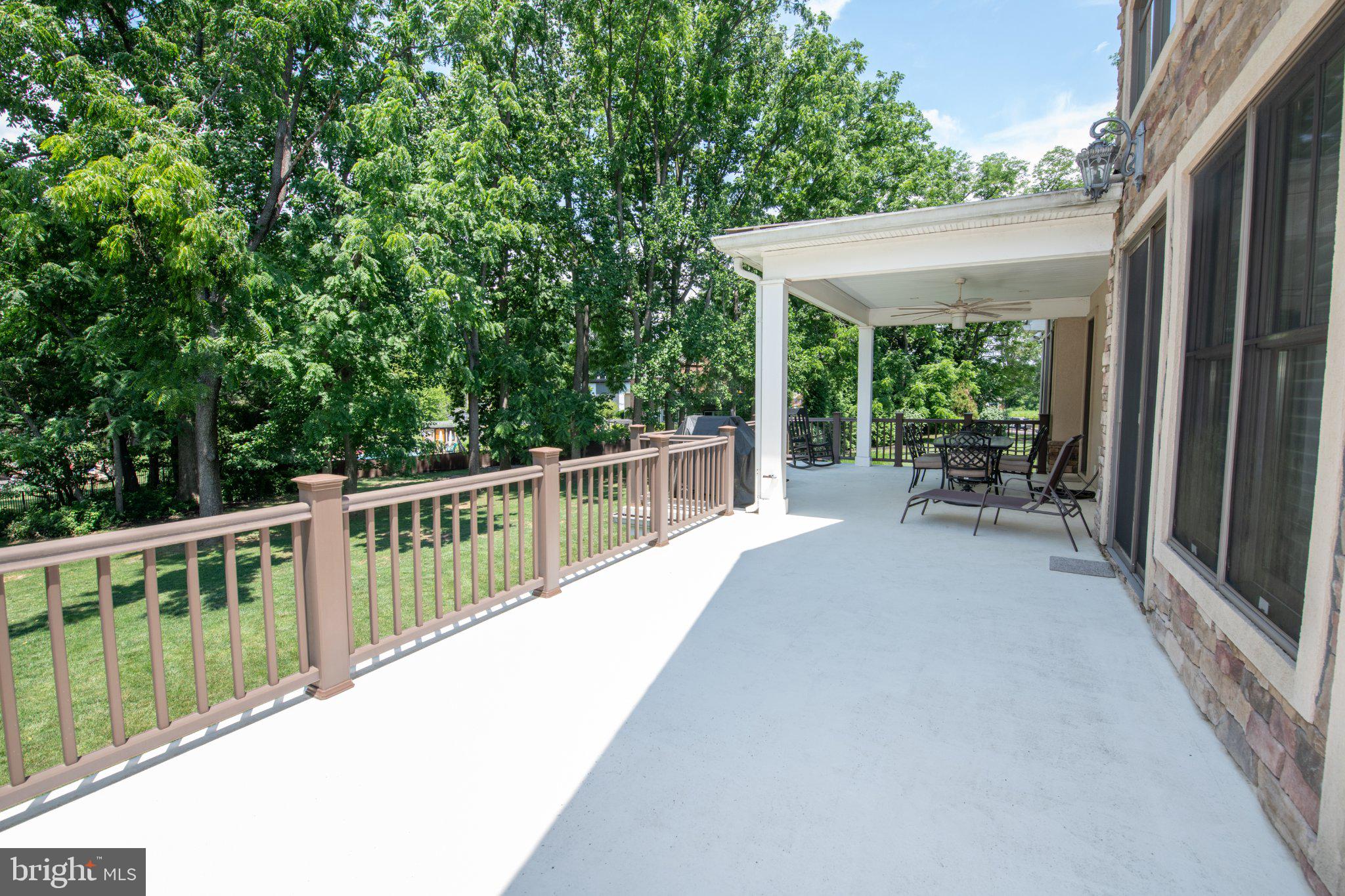 711 Moredon Road Jenkintown, PA 19046 - Photo 118 of 140 Spacious patio with lush greenery.
