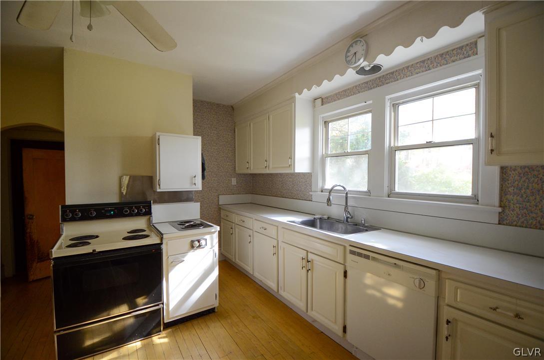 152 Sterling Road Mount Pocono, PA 18344 - Photo 10 of 36 a kitchen with stainless steel appliances granite countertop a sink stove and cabinets