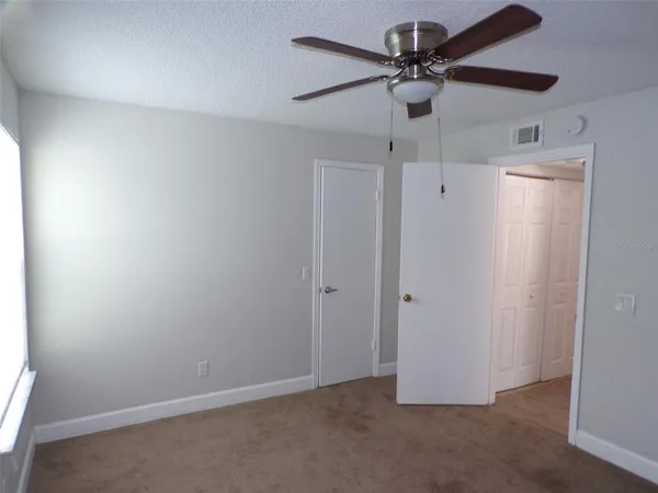 a view of a livingroom with a ceiling fan